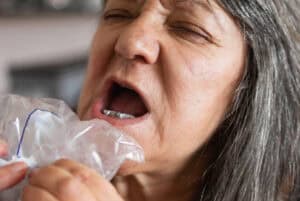 Senior woman trying implant-supported dentures.